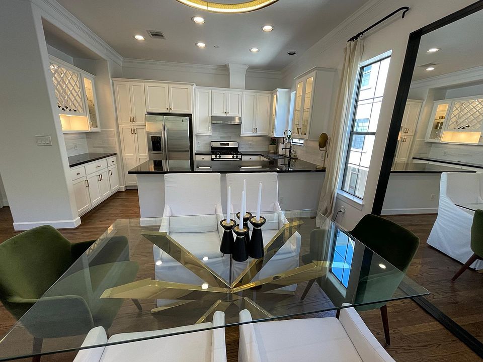 Dining area that easily serviced by an open kitchen. Counter stools fit under the kitchen ledge.