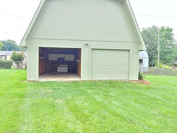 1 full bay of garage in back yard for storage and work shop