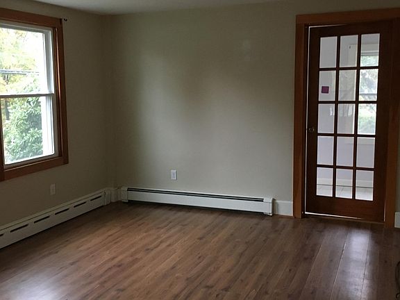 Living room... showing entrance to addition storage room