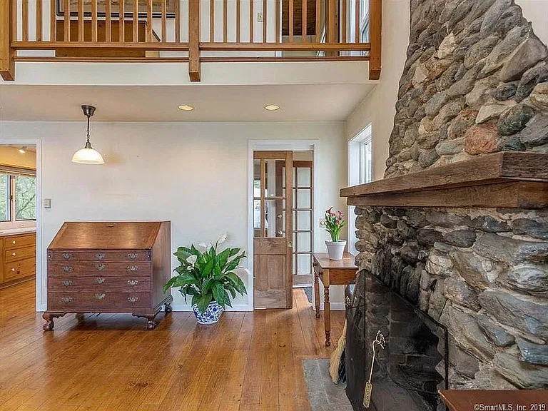 1930s fireplace and view of front entrance
