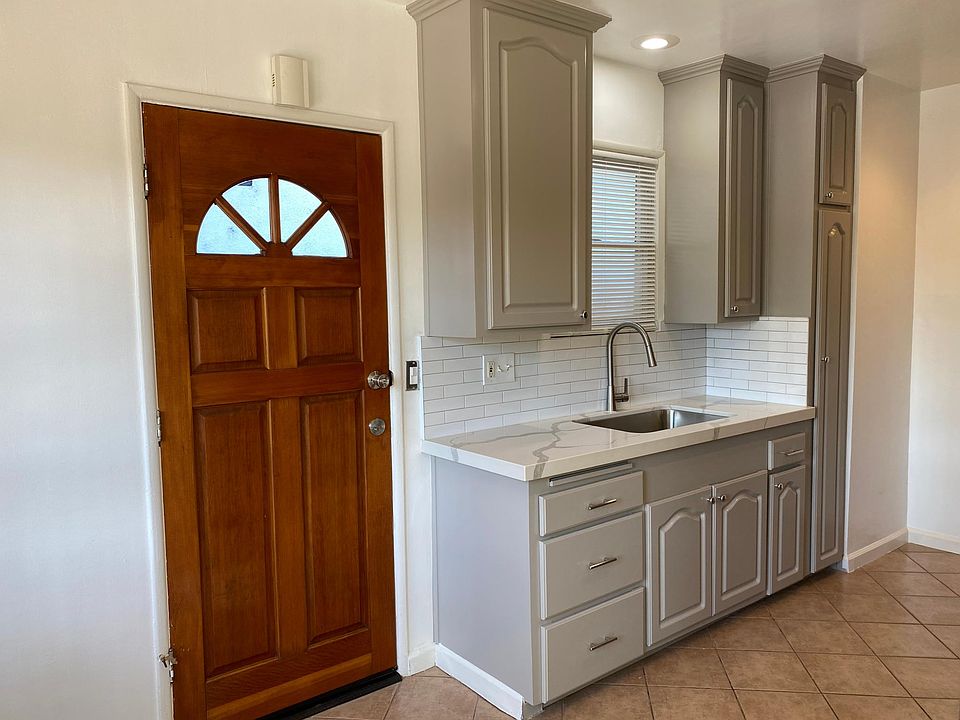 Newly remodeled kitchen with quartz countertop, stainless steel sink, gas stove and new Washer & Dryer