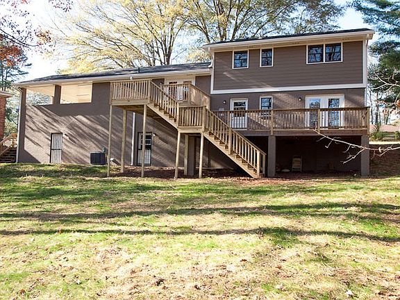 back of house with decks