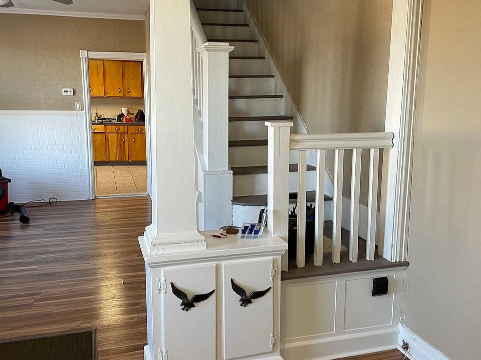 Large, open entryway and living room.