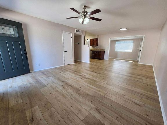 Living room. freshly painted inside of the house. Brand new Flooring.