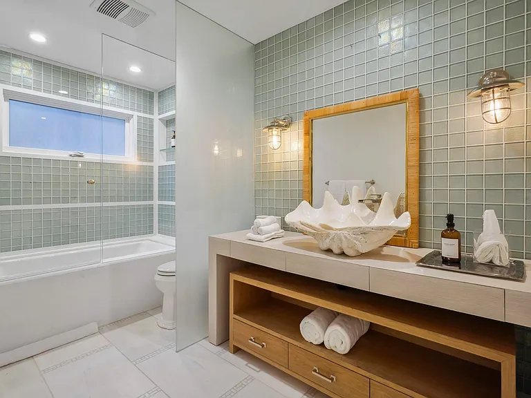 Coastal charm is alive in every detail of this serene retreat.