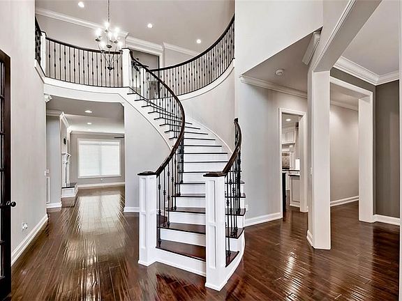 A grand staircase welcomes you home.