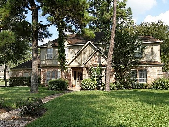 Nestled among the tall trees, this home has done many updates.