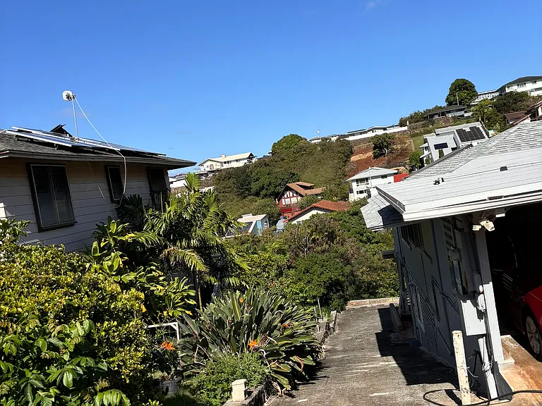 Driveway leading to the back of the house