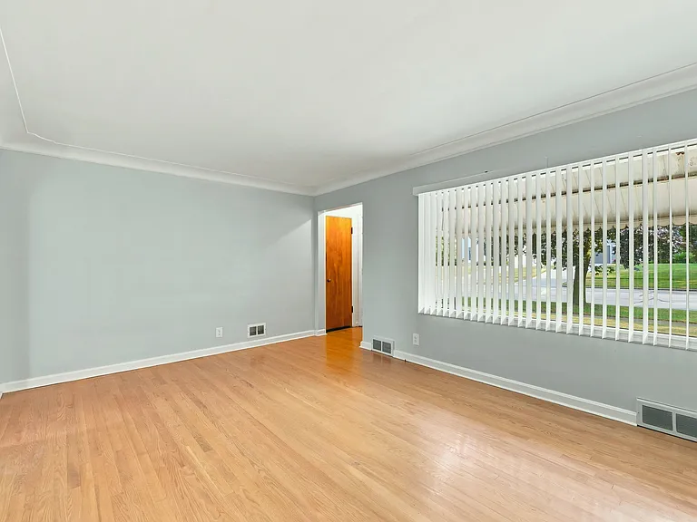 Big living room window lets in lots of light if you want it, blinds if you don't.