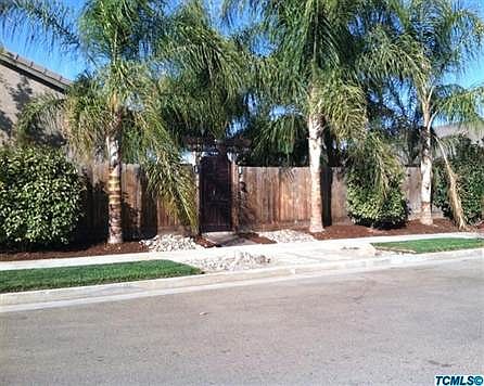 Lush landscaping complete with low voltage yard lights in front and back yards.