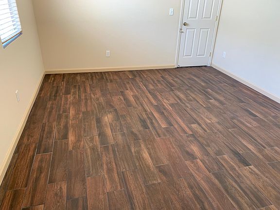 Family room with porcelain tile flooring.