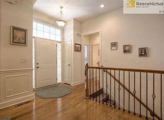 The front entry is very inviting as friends and family enter this open floor plan ranch home with gleaming hardwood floors.