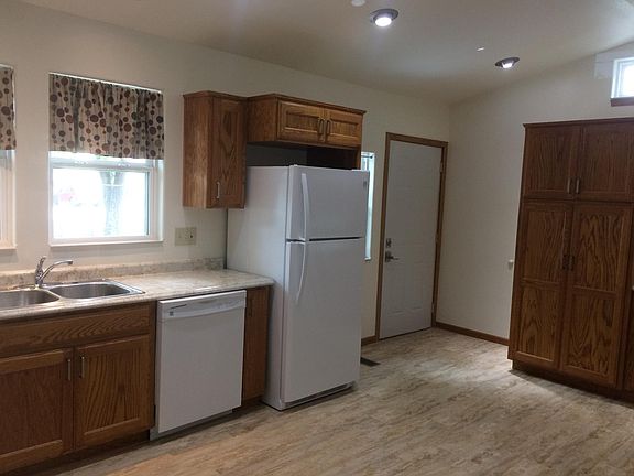 Large kitchen with dishwasher and lots of cabinet space.