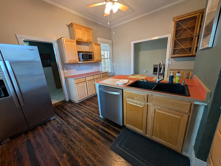 Ample cabinet space. New sink and faucet. Comes with toaster, microwave, oven, large fridge, and basic dishes.