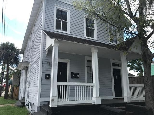 Building, unit is on the left corner bottom floor