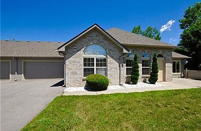 Exterior - Entry with Patio and 2-Car Attached Garage