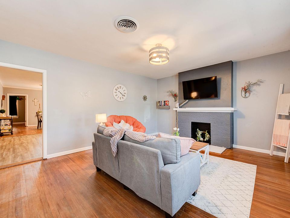 Living Room leads into a large Kitchen.