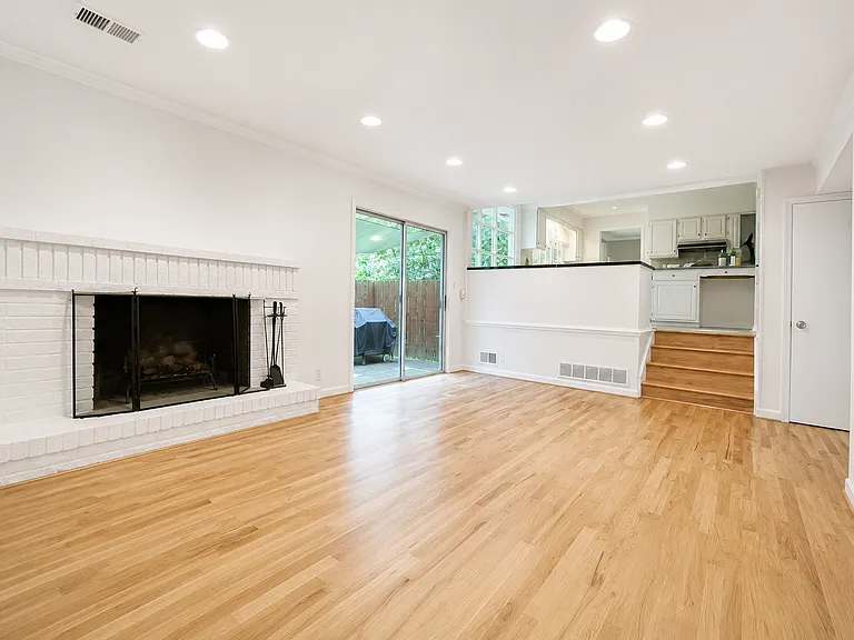 Family Room, sliding door to the deck, steps up to the kitchen.