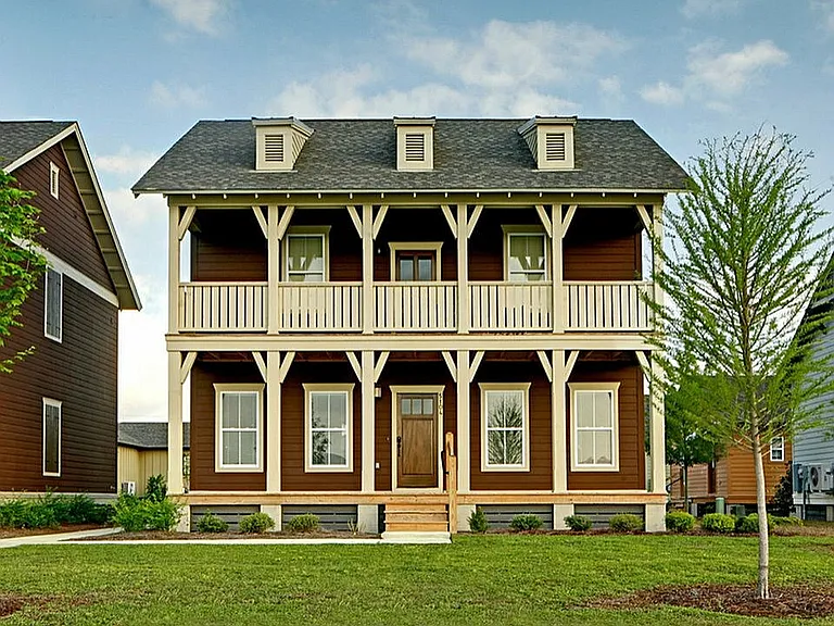 Experience suburban living in this charming two-story home with an inviting porch.