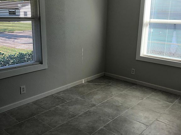 Tile floors throughout, no-string safety blinds on all windows, security devices on all windows that will come with the property,