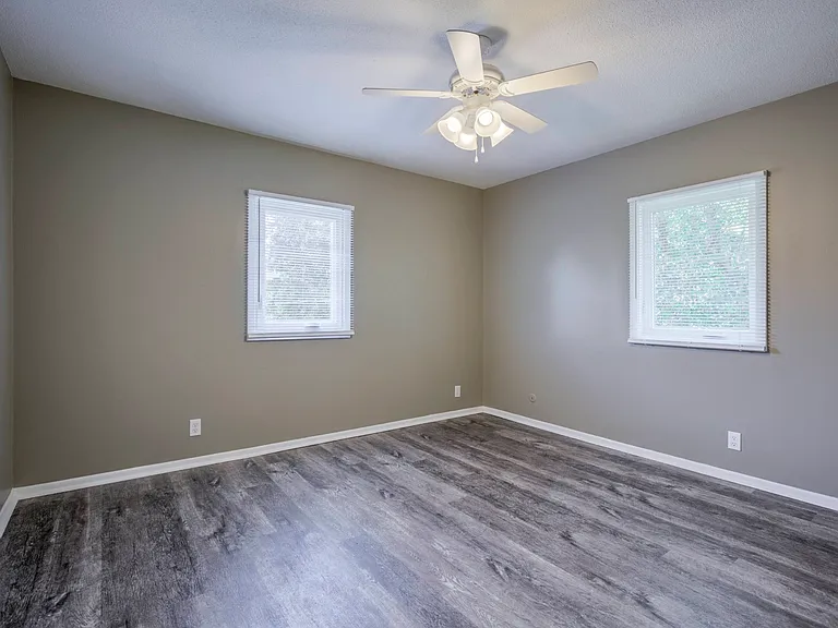 Modern bedroom in a unit at Ashland Park Apartments.