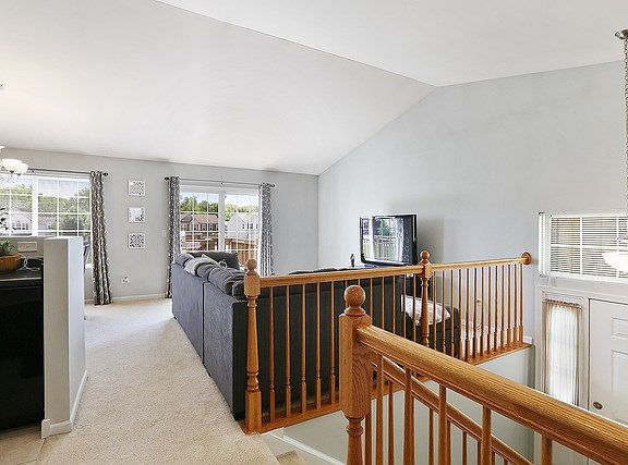 Laid out as a true "up/down" split level, the main floor is elevated and open on one end of the unit