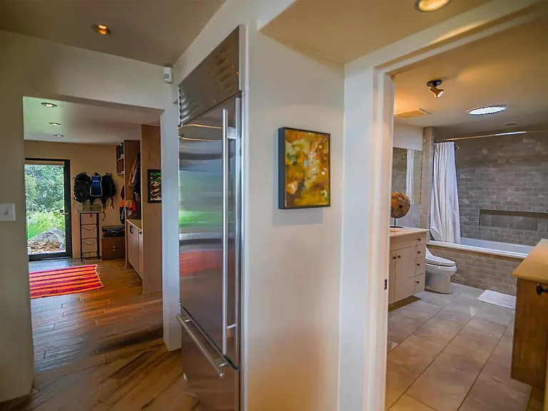 Laundry / mud room and guest bathroom with full tub/shower