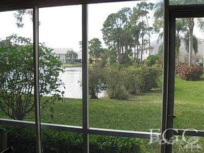 Lanai view of landscaping and lake which offer more privacy.