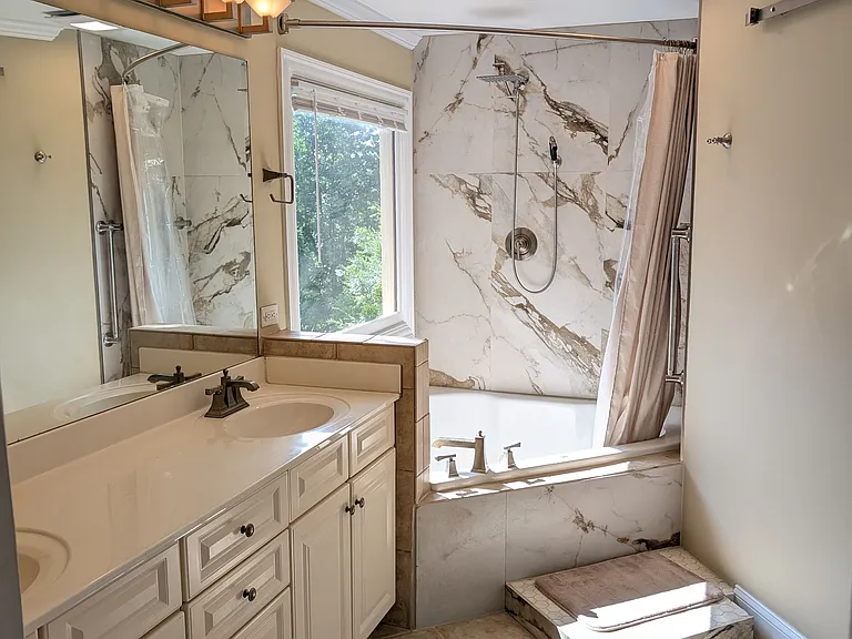 Newly remodeled aster bath has rain shower, body wand, huge jetted tub, and ultra quiet exhaust fan.
