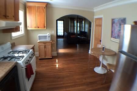 Parking in the back accesses a second staircase leading to the back door into the kitchen.