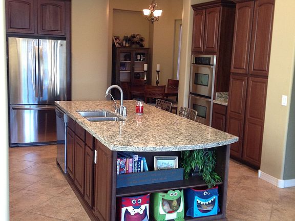 Gourmet Kitchen with double ovens, granate, stainless steel appliances