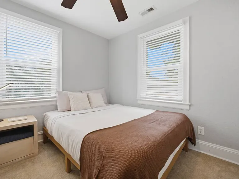 Bedroom 4: A cozy, quiet spot with a queen size bed for a great night's sleep.