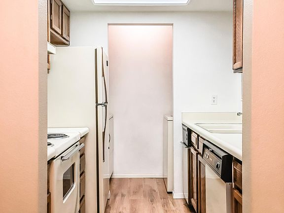 Fully equipped kitchen with hardwood floors, new refrigerator dishwasher, range,