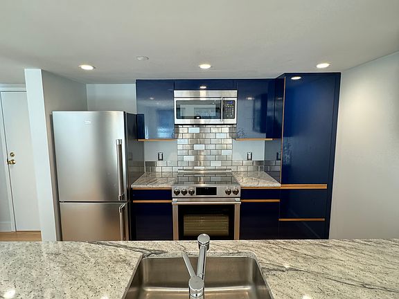 Updated kitchen with brand new appliances, counter tops, range, etc.