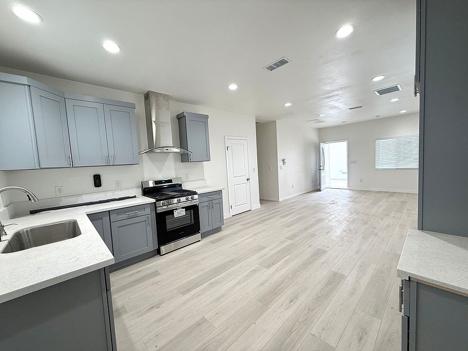 View from the back of kitchen area to the front door