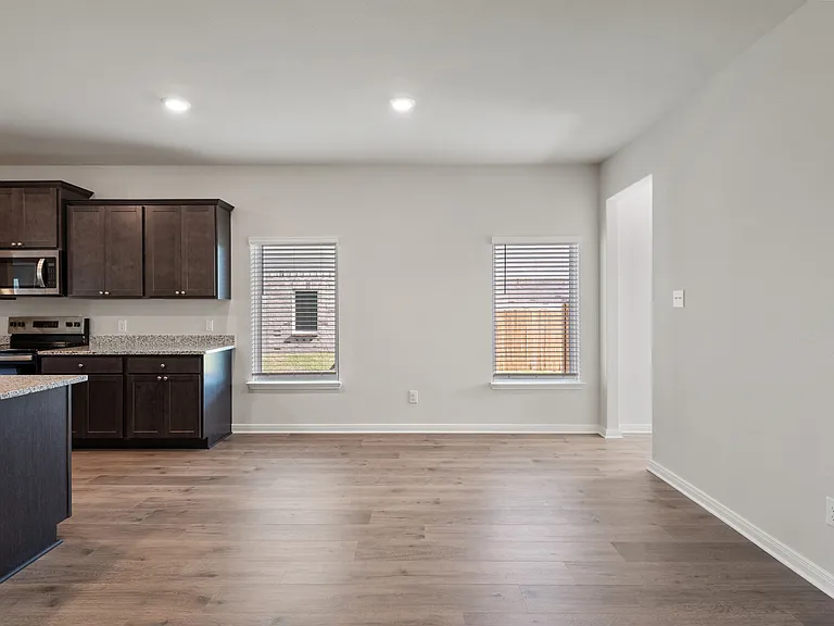 The dining room is a cozy space next to the kitchen.