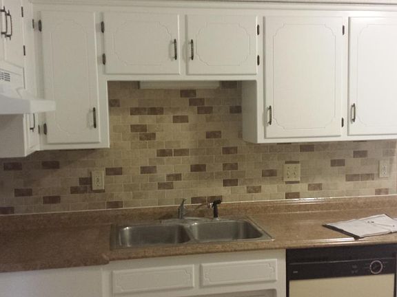 Nice tile backsplash, tile floor in kitchen