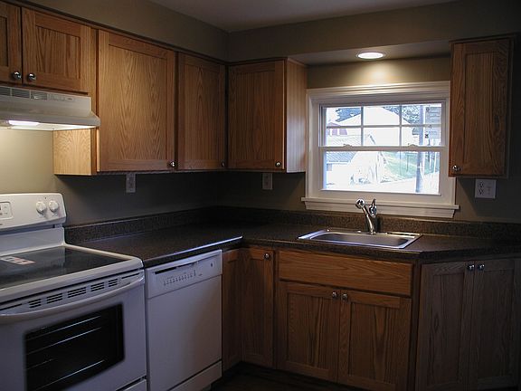 Kitchen-Custom Solid Oak Cabinets, All new appliances, and pergo flooring.