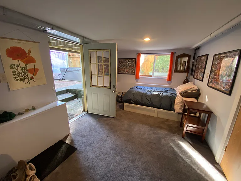 Extra bed in TV room for guests, door to backyard and hot tub