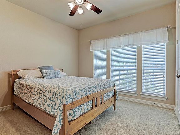 Located just off the foyer, this cheery bedroom would make a perfect guest room or nursery and is conveniently located near the full bath.