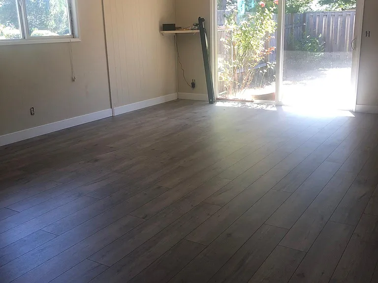 Large LR with 8 ft wide slider opening to fenced in patio area.