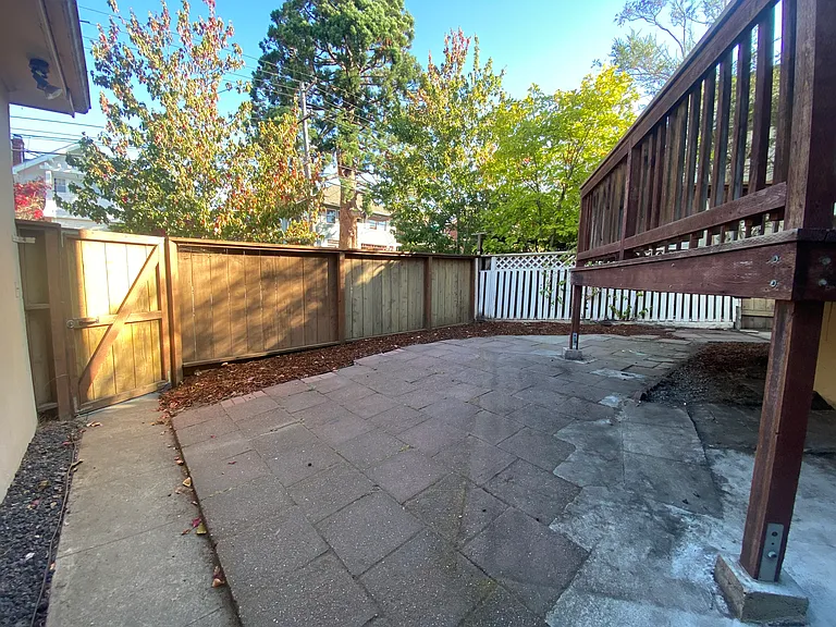 Outdoor patio w/ access to detached garage w/ EV charger.