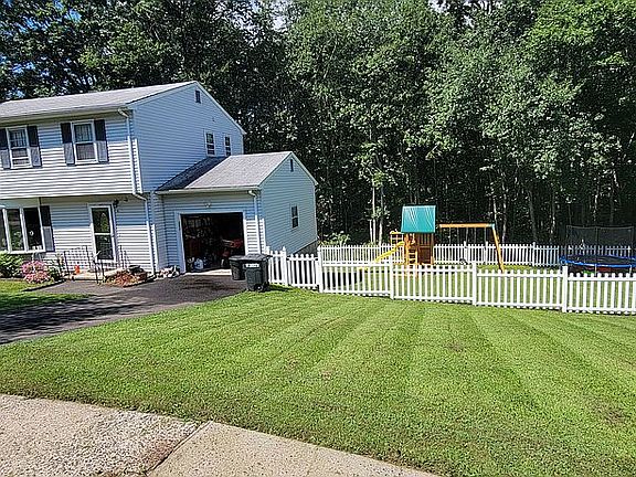 Full view of front yard and 