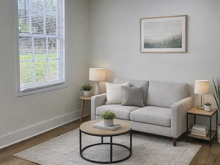 Unit A | Bright living space with natural light and updated flooring