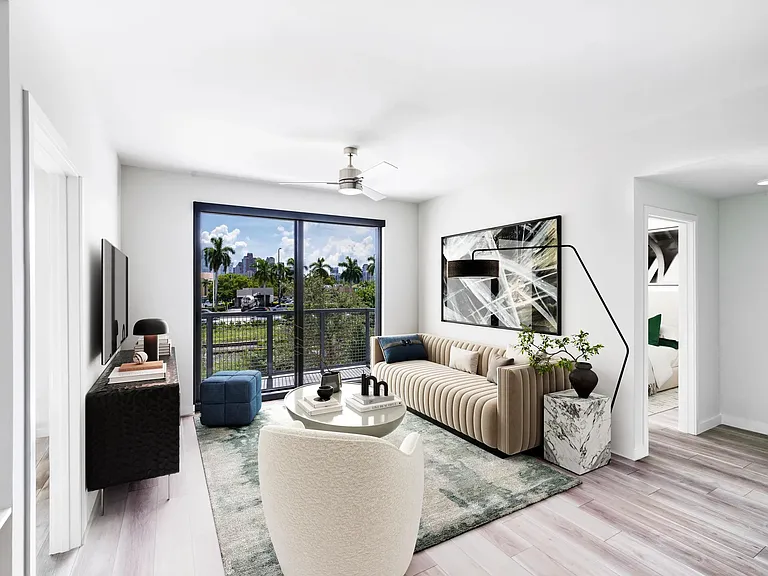 Stylish living spaces at Modera Aventura blend sleek design with views of Miami's tropical landscape.