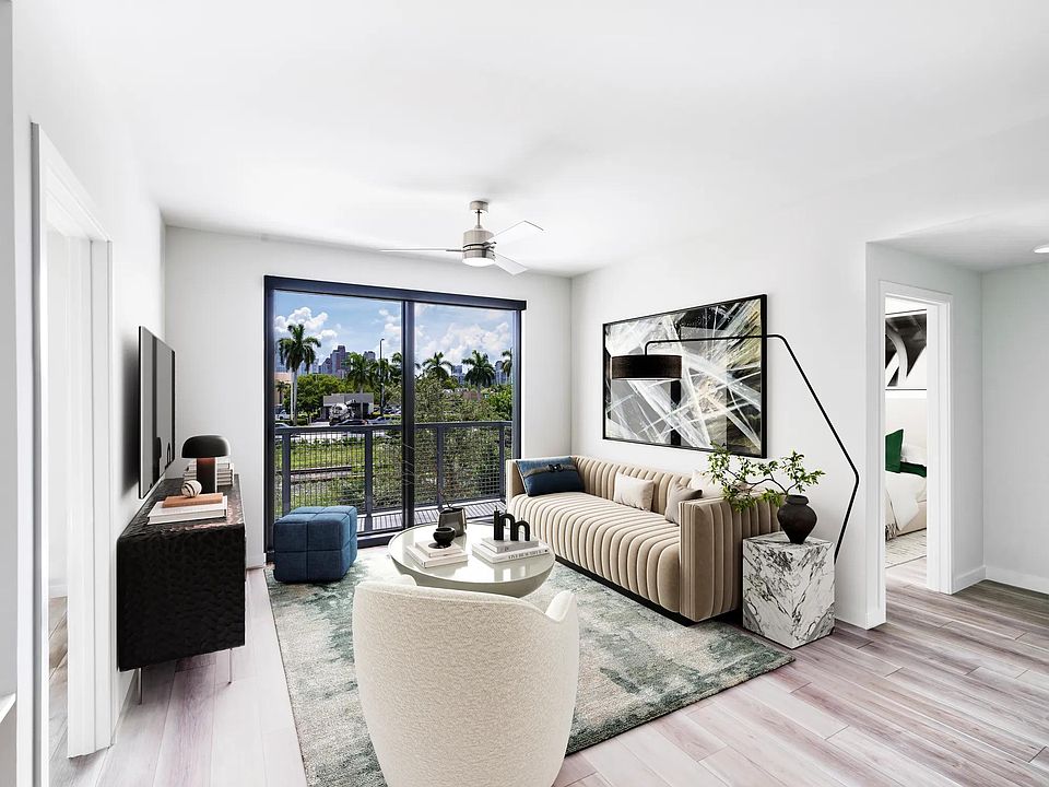 Stylish living spaces at Modera Aventura blend sleek design with views of Miami's tropical landscape.