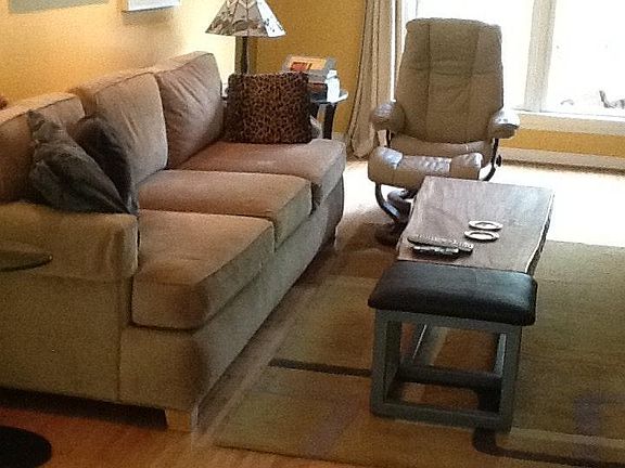 Comfortable sofa and chair pictured has been changed. Artist made coffee table.