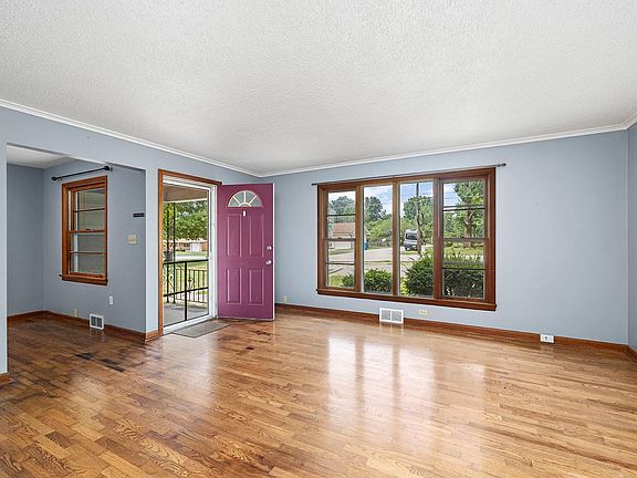 Living Room1 with Large Picture Window and Original Hardwood floors
