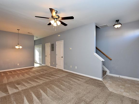 Living room and stairwell.