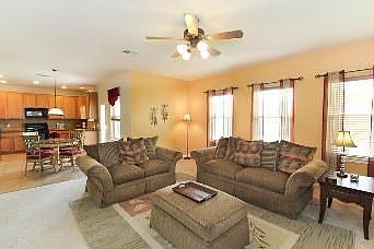 Living Room w/ Fireplace & Ceiling Fan